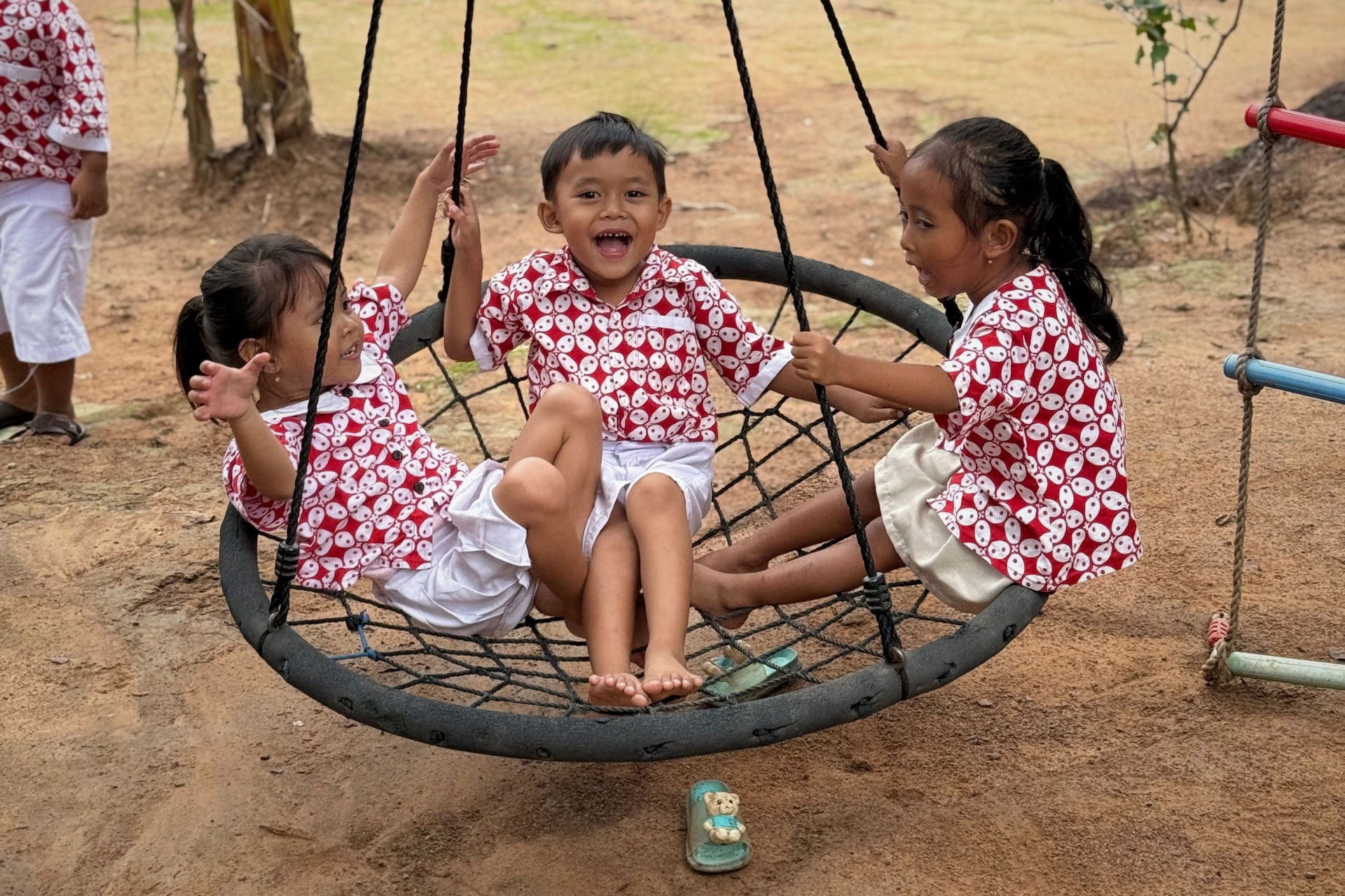 Kejora children on a swing